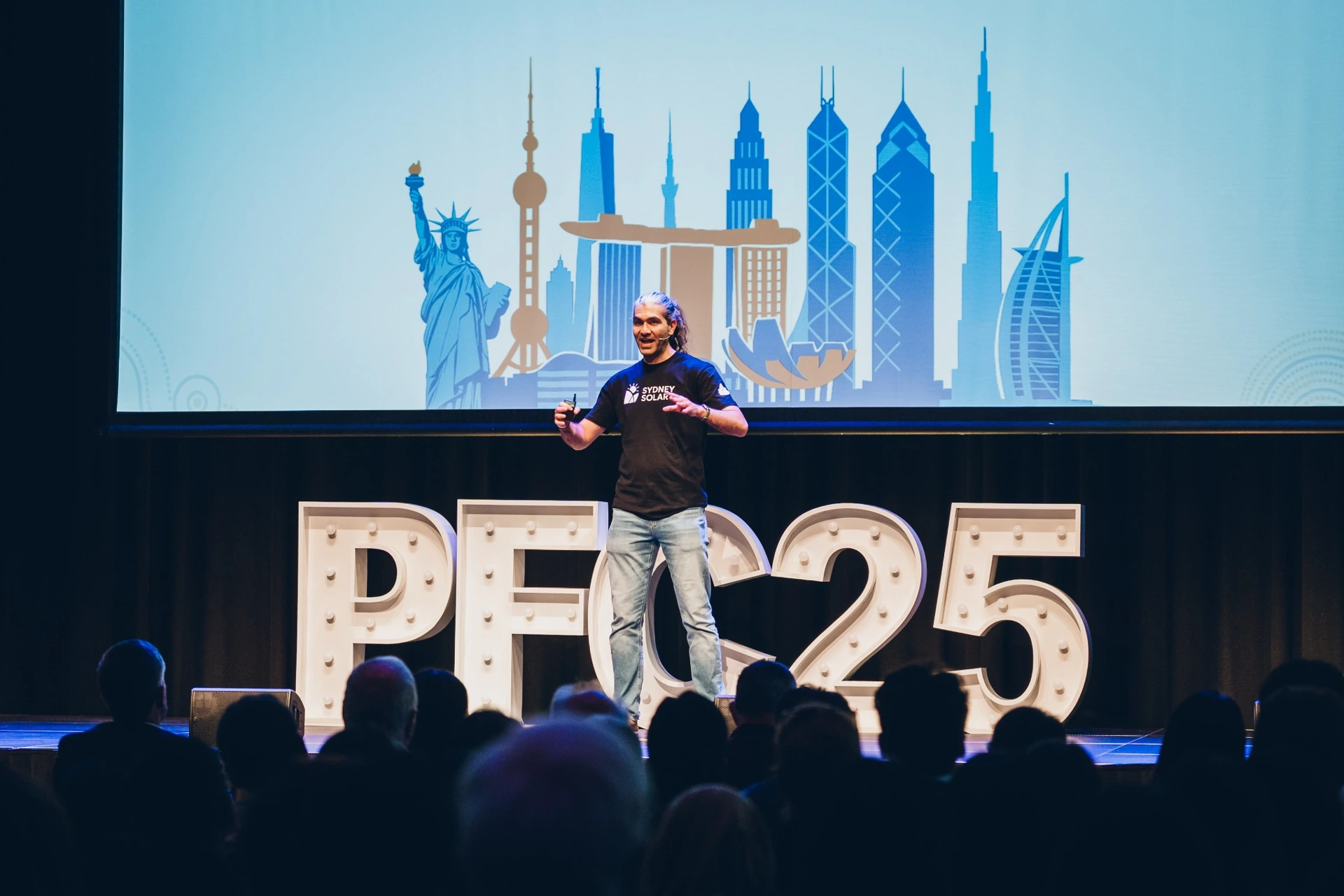 Alireza Yaghoubi presenting Sydney Solar on stage at the 2025 Peter Farrell Cup